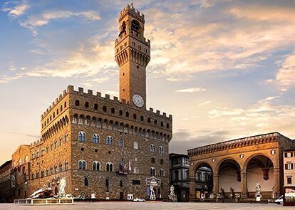 The image displays the Palazzo Vecchio, a prominent landmark in Florence, Italy