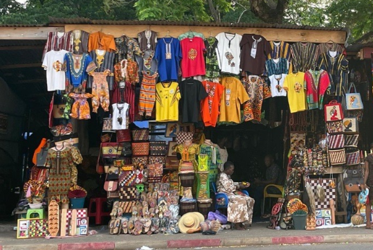 An image of a shop in ghana selling clothes and other items of importance.